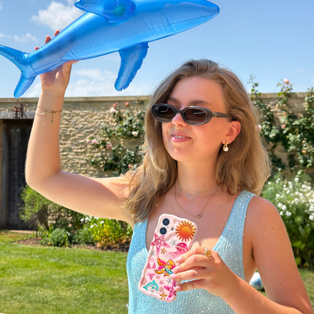 Girl holding dolphin Wavy Pink Paradise Phone Case