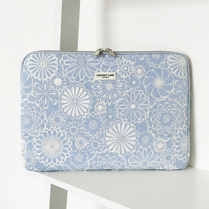 Blue and white flower design Laptop Sleeve with zip closure and Coconut Lane logo. 
