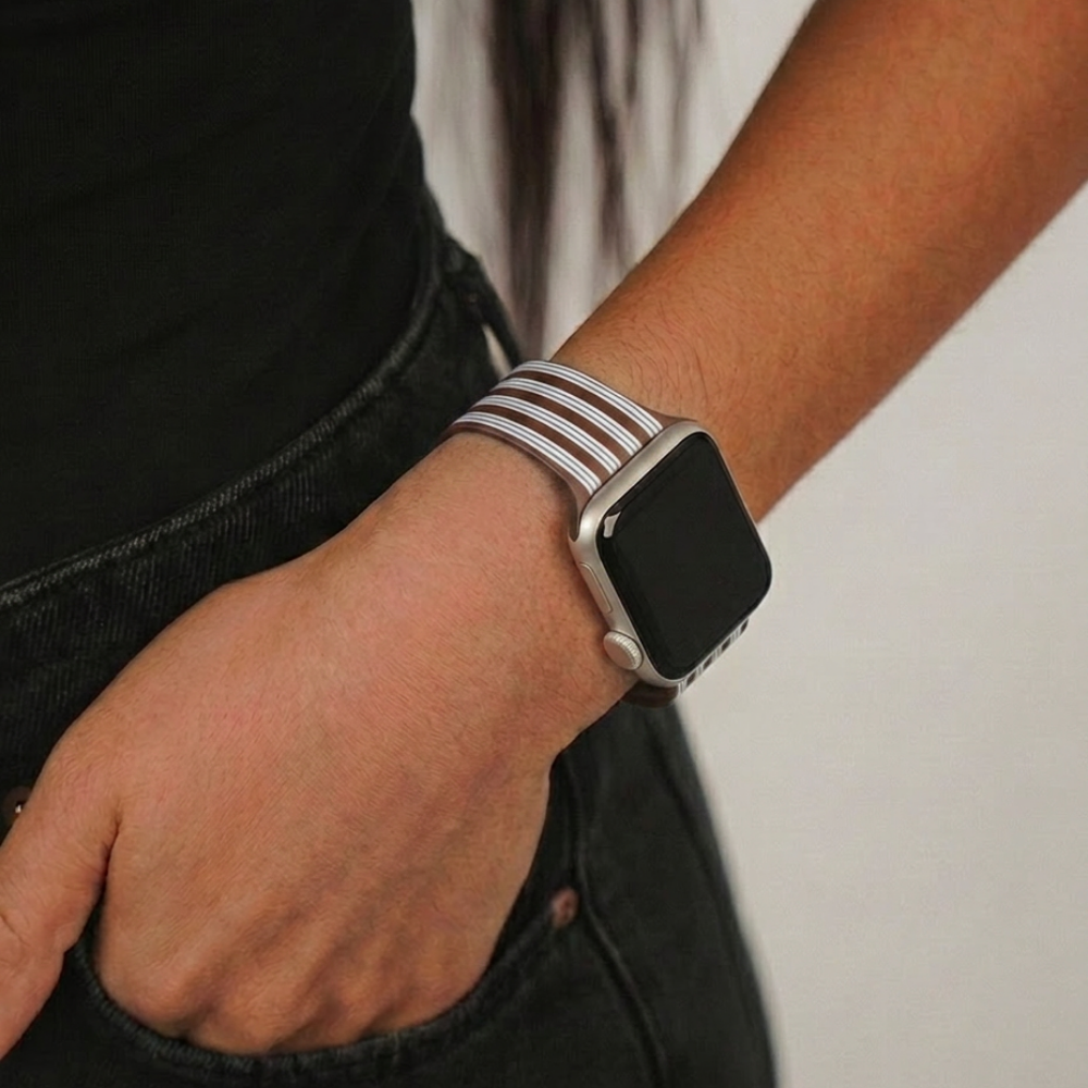 Studio image close up on the brown and blue stripes watch strap