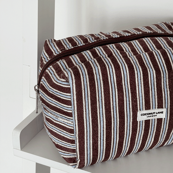 Brown towel texture Makeup Bag with blue and white stripe design. 