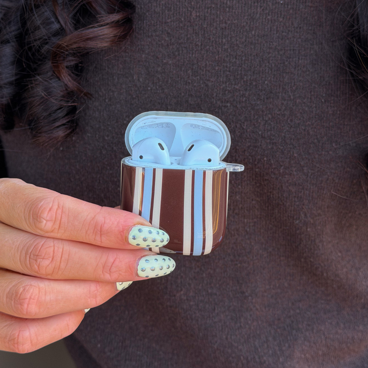 Close up of brown and blue stripe airpods case