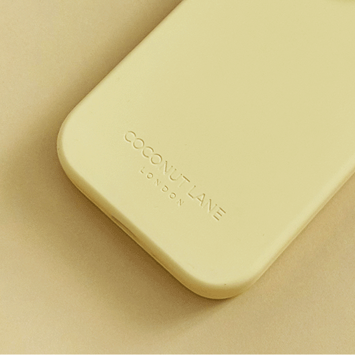 Yellow Phone Case with 'Coconut Lane' branding on a yellow background.