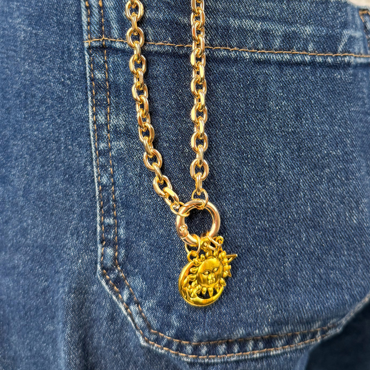 Charm Bar Chain in blue jean pocket with moon and star charms