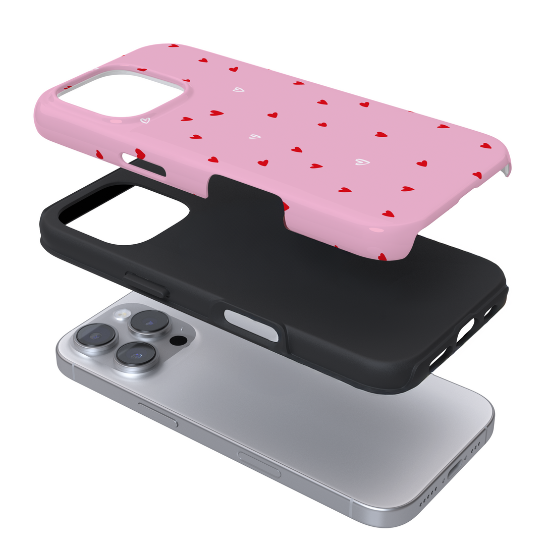 Expanded view of a pink phone case with heart pattern on a white background