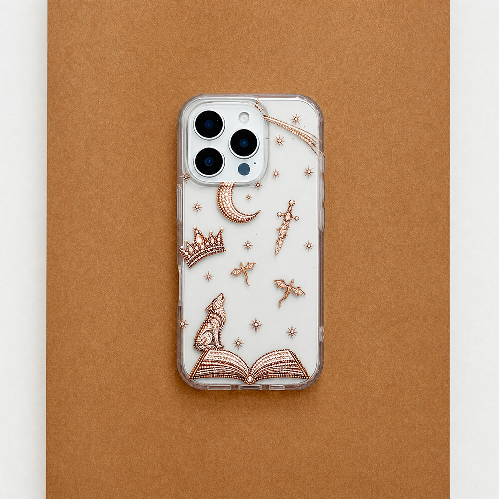 Rear view of Fantasy Girl Clear Phone Case featuring rose gold fantasy-inspired illustrations of a wolf, open book, crown, crescent moon, dagger, dragons and stars, displayed on a brown background.
