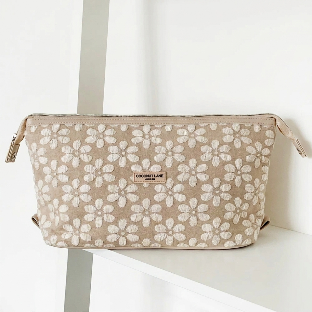Brown and beige floral design Makeup Bag with zip closure and Coconut Lane logo.