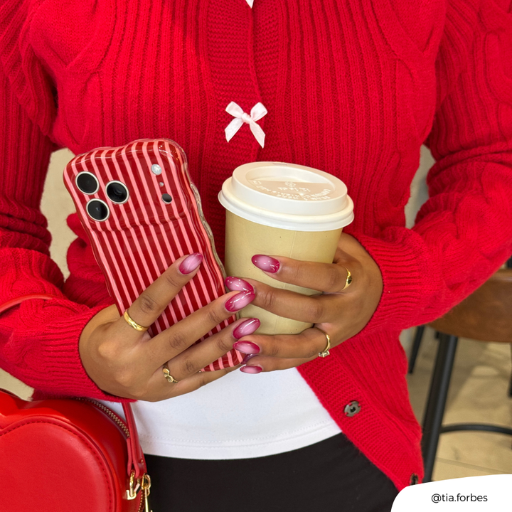 Girl holding coffee and Wavy Mulberry Stripes Phone Case wearing red bow cardigan