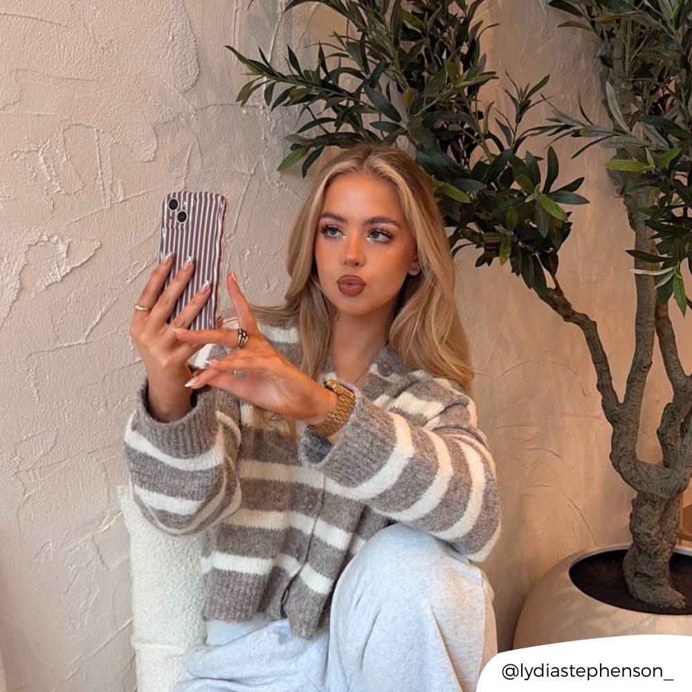 Girl in aesthetic cafe taking a selfie with wavy chestnut stripes phone case