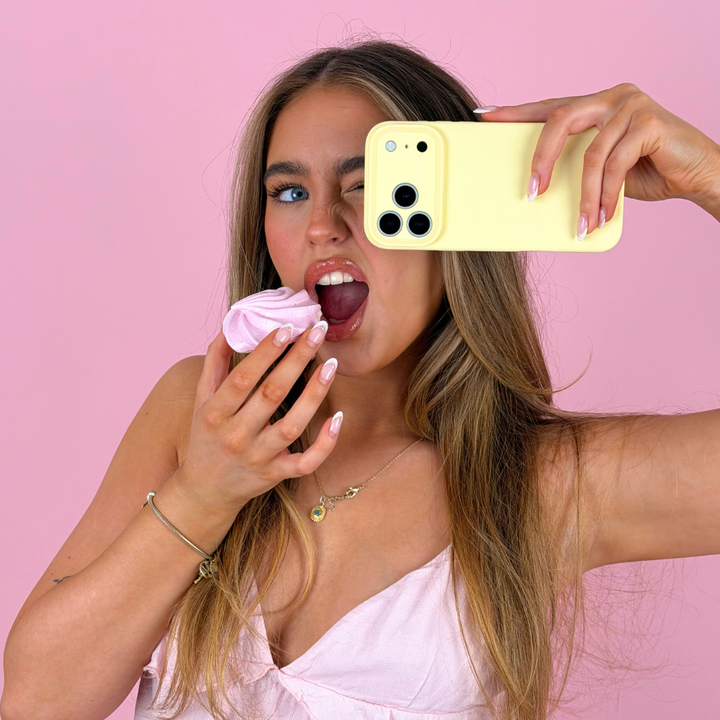 Girl eating pink biscuit holding the butter soft butter yellow phone case