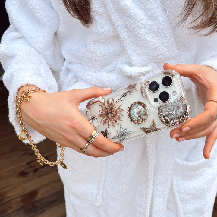 Girl holding Pastel Celestial Phone Case with celestial phone strap attached