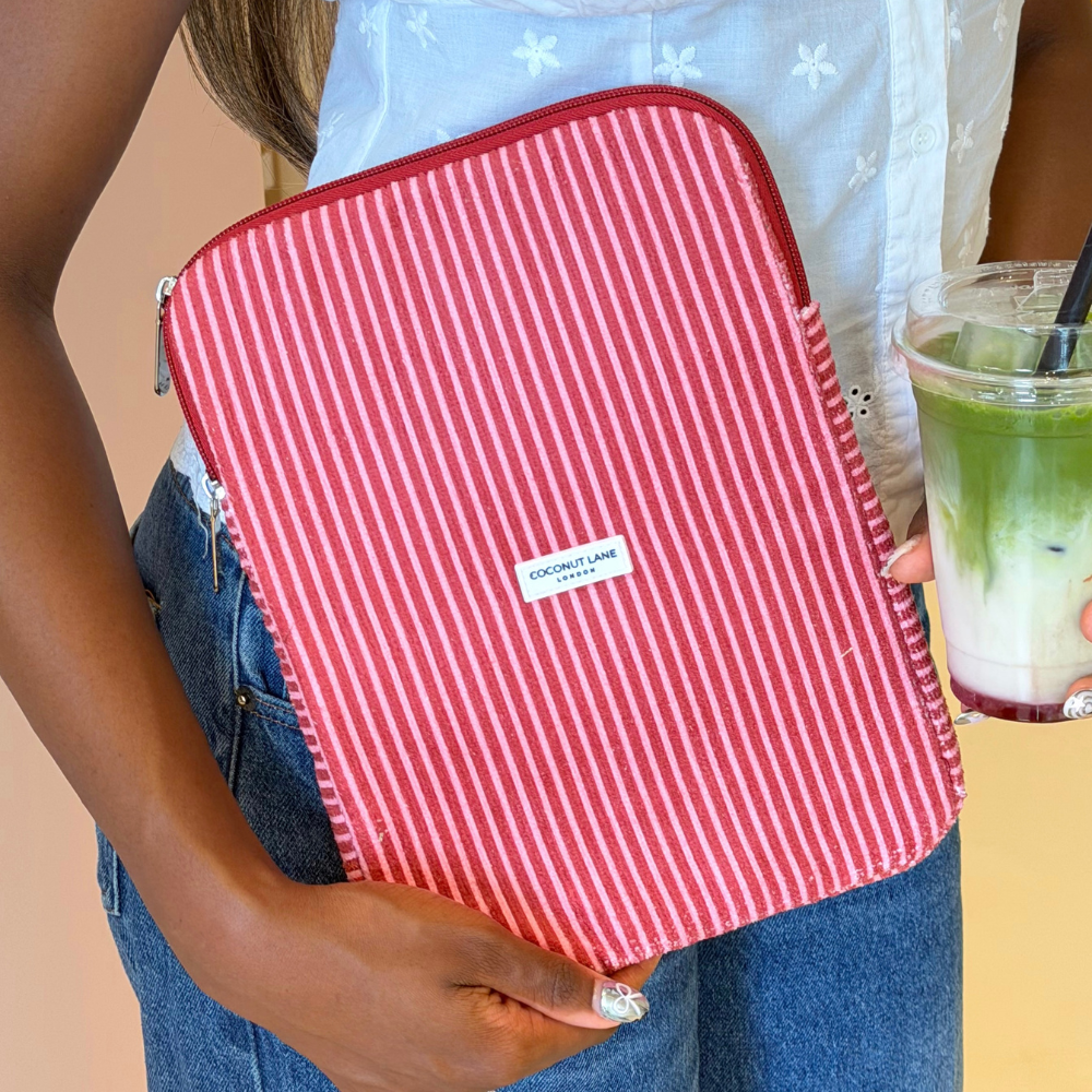 Girl holding matcha with her Mulberry Stripes iPad Sleeve